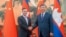 FILE - Cambodian Prime Minister Hun Manet, left, shakes hands with Chinese President Xi Jinping during a ceremony in Beijing on Sept. 15, 2023. (Cambodia's Prime Minister Telegram via AP)