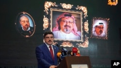 FILE - Yasin Aktay, an adviser to Turkey's President Recep Tayyip Erdogan, speaks during an event organized to mark the 40th day of the death of Saudi writer Jamal Khashoggi, in Istanbul, Nov. 11, 2018.