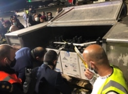FILE - A batch of the Pfizer-BioNTech COVID-19 vaccine arrives at Queen Alia International Airport in Amman, Jordan, January 11, 2021.