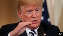 President Donald Trump speaks during a news conference in the East Room of the White House, Monday, July 30, 2018, in Washington.