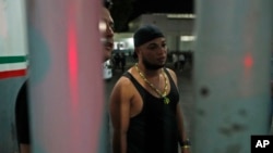 Cuban migrant Usmani Velazquez Vallejo talks with reporters inside an immigration detention center, where he and his family are being held, in Tapachula, Chiapas state, Mexico, late April 25, 2019.