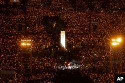 Thousands of people attend a candlelight vigil for victims of the Chinese government's brutal military crackdown three decades ago on protesters in Beijing's Tiananmen Square at Victoria Park in Hong Kong, June 4, 2019.