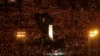 FILE - Thousands of people attend a candlelight vigil for victims of the Chinese government's brutal military crackdown three decades ago on protesters in Beijing's Tiananmen Square at Victoria Park in Hong Kong, June 4, 2019.