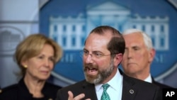 FILE - Health and Human Services Secretary Alex Azar, with White House coronavirus response coordinator Dr. Deborah Birx, left, and Vice President Mike Pence, speaks to reporters, March 2, 2020, in Washington.