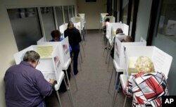 Voters cast their ballots at the Santa Clara County Registrar of Voters, Oct. 24, 2016, in San Jose, California. Voting rights advocates say they will monitor more polling places than usual on Election Day amid concerns about possible voter intimidation.
