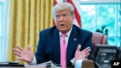 FILE - President Donald Trump speaks during a meeting with Senate Majority Leader Mitch McConnell of Kentucky and House Minority Leader Kevin McCarthy of California, in the Oval Office of the White House, July 20, 2020, in Washington.