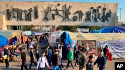 Anti-government protesters gather in Tahrir Square in Baghdad, Iraq, Dec. 22, 2019. 