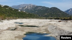 A general view shows cracked and dry earth in the dried-up artificial Broc lake in Le Broc near Nice as the Alpes-Maritimes department faces a severe drought, France, Oct. 28, 2022.