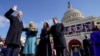 Joe Biden is sworn in as the 46th president of the United States by Chief Justice John Roberts as Jill Biden holds the Bible during the 59th Presidential Inauguration at the U.S. Capitol.