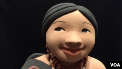 A closer look at one of Kathleen Wall's ceramic dolls. (J.Taboh/VOA)
