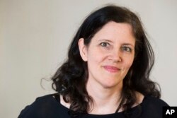 FILE - Documentary filmmaker Laura Poitras poses for a portrait in New York, April 16, 2014.