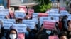 Protesters hold posters in support of the National Unity Government (NUG) during a demonstration against the military coup on Global Myanmar Spring Revolution Day in Taunggyi, Myanmar, on May 2, 2021. 