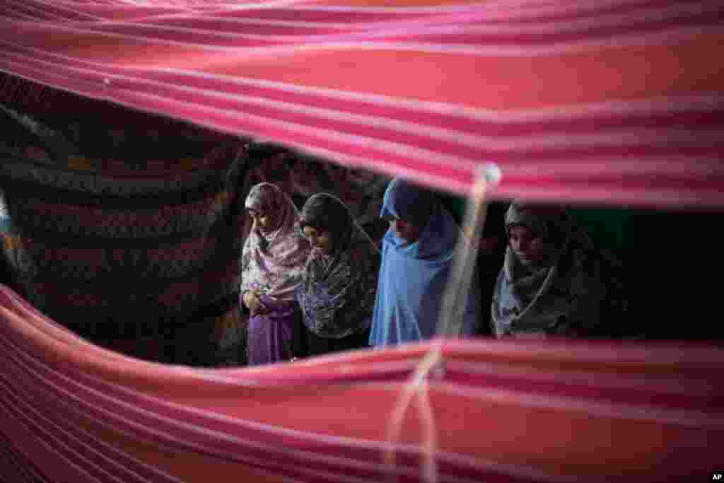 Morsi Supporters pray after breaking their fast during Ramadan, in Nasr City, Cairo, Egypt, July 11, 2013. 