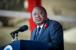 FILE - Kenya's President Uhuru Kenyatta speaks at Nyayo Stadium in the capital Nairobi, Feb. 11, 2020.