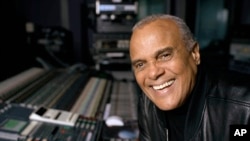 FILE - Actor and singer Harry Belafonte poses for a portrait at a New York recording studio, Nov. 1, 2001.
