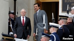 U.S. Secretary of Defense Jim Mattis stands with Qatari Emir Sheikh Tamim Bin Hamad al-Thani during an Enhanced Honor Cordon at the Pentagon, in Arlington, Virginia, near Washington, April 9, 2018.