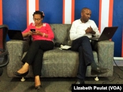 Dr. John Mark Bwanika and his colleague engage Twitter users, answering questions on cancer prevention and screening.