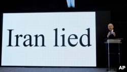 FILE - Israeli Prime Minister Benjamin Netanyahu presents material on Iranian nuclear weapons development during a press conference in Tel Aviv, April 30 2018.