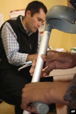 The chief doctor at Zithulele, Ben Gaunt, refers a disabled patient to Grobicki