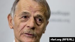 
A relative weeps on the ground in an alleyway near the body of a man who had been shot in the head as the angry crowd shouts at the police, in the Mathare slum of Nairobi, Kenya. Kenya's election took an ominous turn as violent protests erupted in the capital.