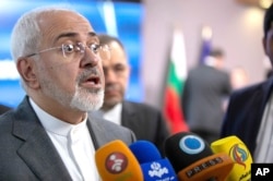 FILE - Iranian Foreign Minister Javad Zarif speaks with the media after a meeting with European Union foreign policy chief Federica Mogherini at the Europa building in Brussels, May 15, 2018.