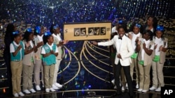 Host Chris Rock and Girl Scouts participate in a skit at the Oscars on Feb. 28, 2016, at the Dolby Theatre in Los Angeles.