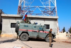 Russian forces' armored vehicles patrol the Syrian border in Kobani, Oct. 23, 2019. Russian military police began patrols on part of the Syrian border, quickly moving to implement an accord with Turkey that divides control of northeastern Syria.