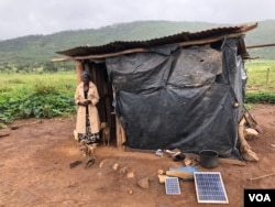 Takaitei Chigayo and her husband have been sleeping in a shelter of plastic sheeting with their four children after Zimbabwe’s government destroyed their home in 2015 to make way for former first lady Grace Mugabe’s game park, in Mazowe district, Zimbabwe, March 2, 2018. (S. Mhofu/VOA)