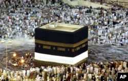 FILE - Pilgrims circle the Kabaa at the Great Mosque, Islam's holiest shrine, in Mecca, Saudi Arabia, Jan 17, 2005.