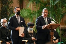 President of the 2021 United Nations Climate Change Conference, COP26, Alok Sharma, right, and Italian Foreign Minister Luigi Di Maio attend a conference at the Vatican, Oct. 4, 2021.
