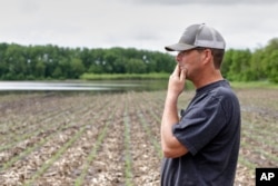 Jeff Jorgenson looks over a partially flooded field he farms near Shenandoah, Iowa, May 29, 2019. About a quarter of his land was lost this year to Missouri River flooding, and much of his remaining property has been inundated with heavy rain and water from the neighboring Nishnabotna River.