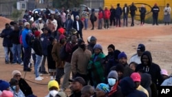 Voters line up to cast their ballot for general elections in Alexandra, near Johannesburg, South Africa, Wednesday, May 29, 2024. 