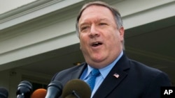 FILE - U.S. Secretary of State Mike Pompeo speaks to reporters outside the White House in Washington, Oct. 9, 2018. 