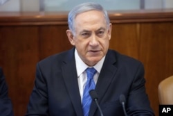 Israel's Prime Minister Benjamin Netanyahu chairs a weekly cabinet meeting in Jerusalem on August 17, 2014.