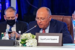 Egypt's Foreign Minister Sameh Shoukry addresses his Arab counterparts during a consultative meeting in the Qatari capital Doha, June 15, 2021.