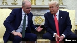 U.S. President Donald Trump meets with Irish prime minister Micheal Martin in the Oval Office at the White House in Washington, March 12, 2025.