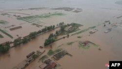This picture taken on July 28, 2024, and released from North Korea's official Korean Central News Agency (KCNA) via KNS on July 29, 2024, shows flooding after record-breaking heavy rains, in the city of Sinuiju, North Pyongan province.