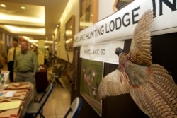 Hunters arriving at the Sioux Falls Regional Airport on Thursday, Oct. 13, 2011 for South Dakota's pheasant hunting season, an even that attracts hunters and sex traffickers.
