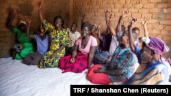 Women pose for a portrait in Wilpii village, Paicho sub-county, Gulu district in Northern Uganda, March 26, 2018.