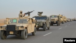 Egyptian Army's armored vehicles are seen on a highway to North Sinai during a launch of a major assault against militants, in Ismailia, Egypt, in this undated handout picture from the Ministry of Defense, Feb. 9, 2018.