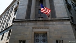 FILE - The U.S. Department of Justice headquarters building is seen in Washington, July 13, 2018.