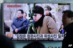 A man passes by a TV screen showing North Korean leader Kim Jong Un during a news program at Seoul Railway Station in Seoul, South Korea, Thursday, March 24, 2016.