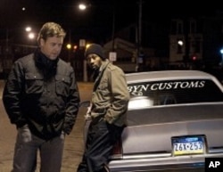 John Brennan (Russell Crowe), left, and Mouss (RZA), right, in THE NEXT THREE DAYS