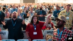 FILE - Attendees sing during a worship service at the Southern Baptist Convention's annual meeting in Anaheim, California, on June 14, 2022. Thousands will gather in Indianapolis, June 11-12, 2024, for this year's meeting.