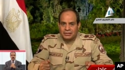 In this image made from video broadcast on Egypt's State Television, Egypt's military chief Abdel-Fattah el-Sissi speaks in a nationally televised speech, announcing that he will run for president, in Cairo, March 26, 2014.