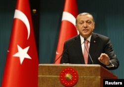 Turkish President Tayyip Erdogan speaks during a news conference following the National Security Council and cabinet meetings at the Presidential Palace in Ankara, July 20, 2016.