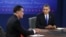 President Barack Obama listens as Republican presidential nominee Mitt Romney speaks during the third presidential debate at Lynn University, in Boca Raton, Florida, October 22, 2012. 