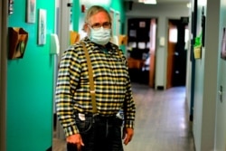 Dr. Tom Dean is pictured at his clinic in Wessington Springs, S.D., Oct. 16, 2020. Dean is one of three doctors in the county, which has seen one of the nation's highest rates of coronavirus cases per person.