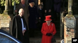 Britain's Queen Elizabeth II waits for her car after attending a Christmas day service at the St Mary Magdalene Church in Sandringham in Norfolk, England, Dec. 25, 2019.