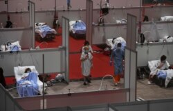 COVID-19 patients are treated at a temporary hospital located at the Ifema convention and exhibition center in Madrid, April 3, 2020.